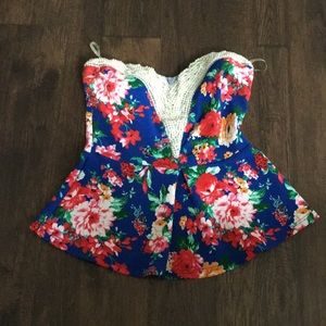 A blue shirt with flower pattern